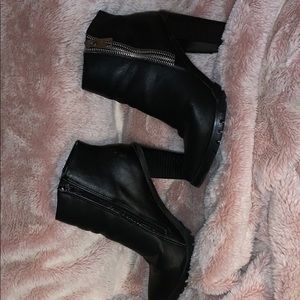 Cute black ankle boots .